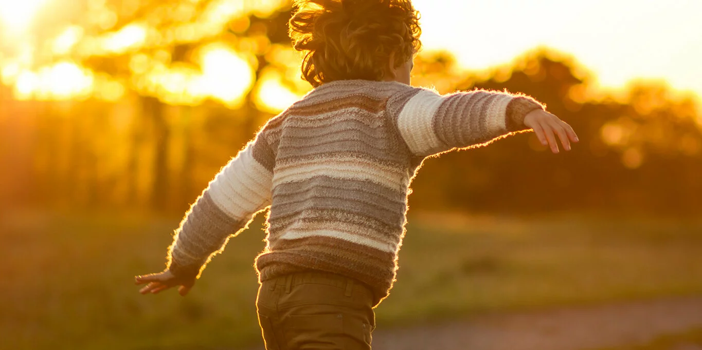 young boy running