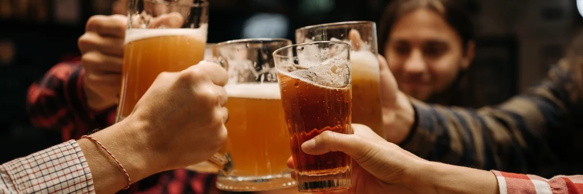 A group of men clinking glasses.