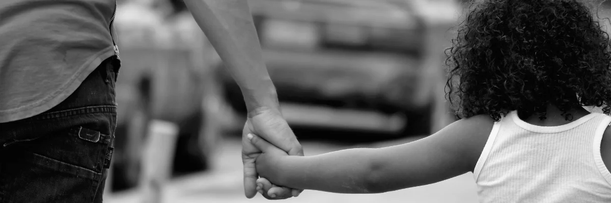 A father and daughter holding hands