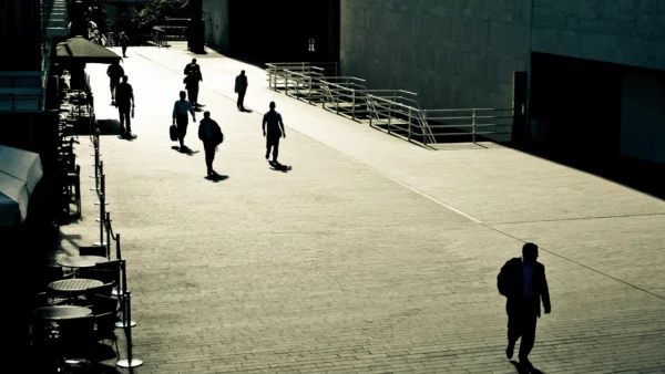 Lost and lonely man walking through a street. Lost and lonely man walking through a street.