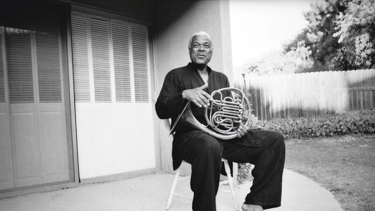 Robert Watt holding an instrument.