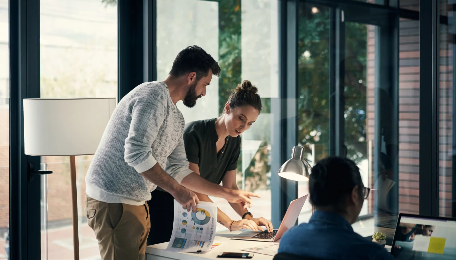 A man and a woman are working together on a project. A man and a woman are working together on a project.