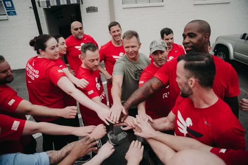 Team RWB in a group huddle.