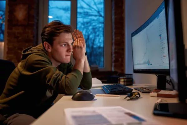 Young man using prediction markets