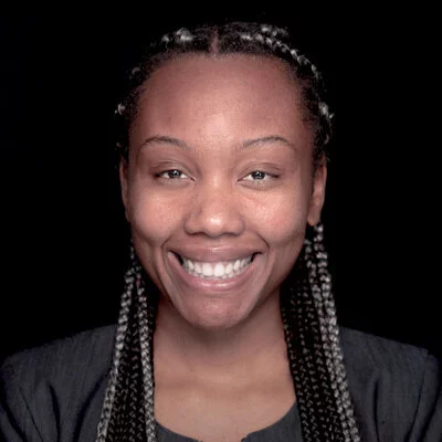 Headshot of Nirel JonesMitchell, a UCLA PhD student researching deaths of despair among impoverished Southern men, with an emphasis on mental health and related policies.