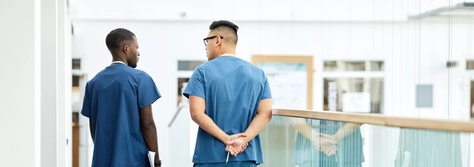  2026/04/two-male-nurses-walking-in-a-hospital-e1775586663831.jpeg 