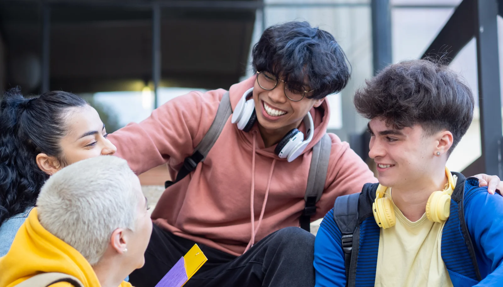 Group of young people talking and laughing