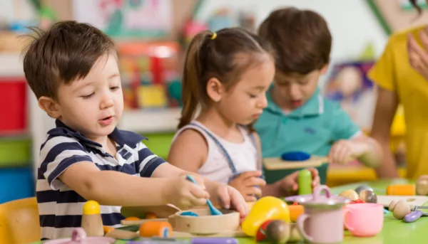 Kindergarteners engage in play during school